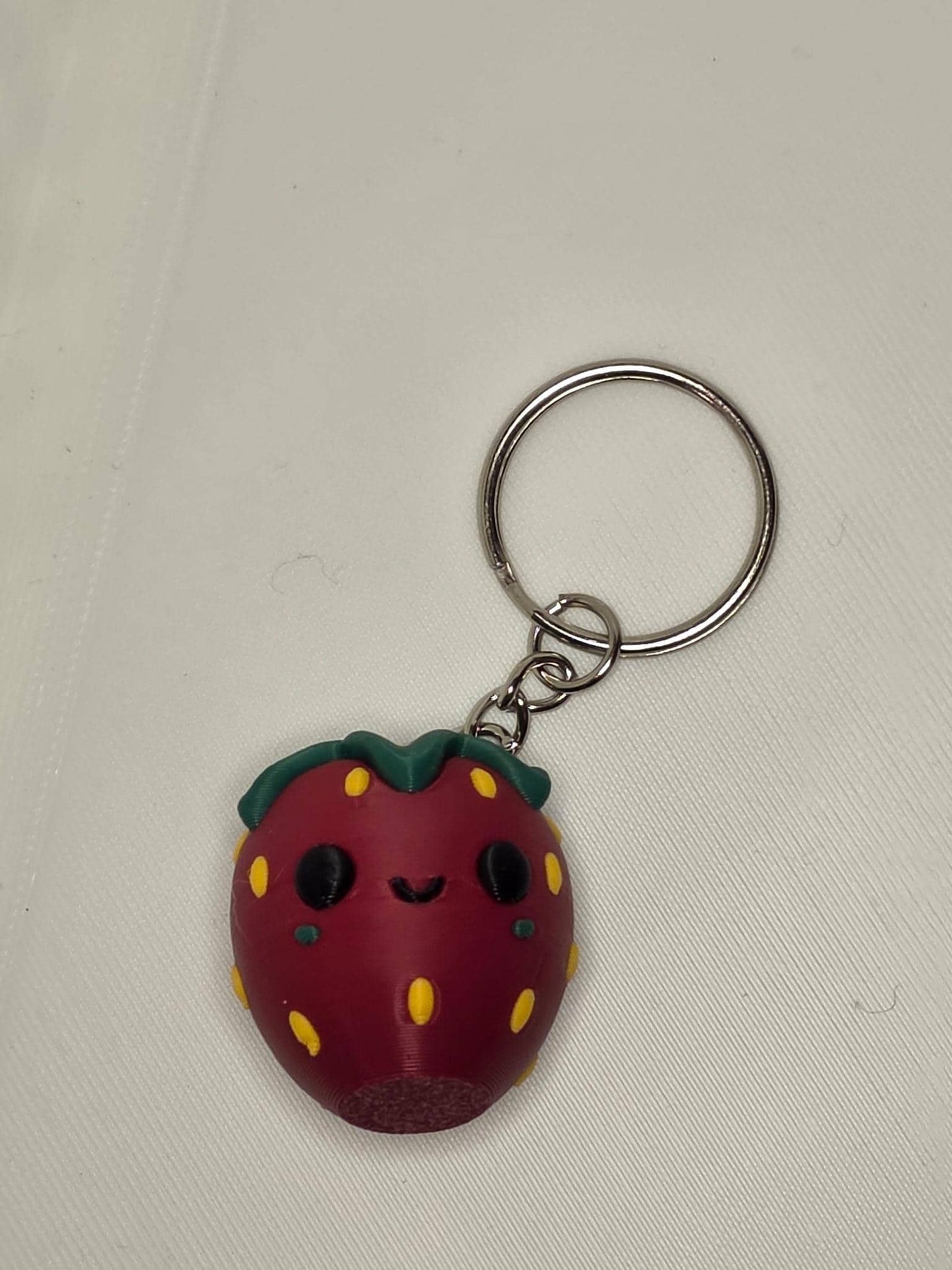 HoneyBunny3D cute strawberry keychain bag accessory charm, featuring a detailed, colorful strawberry design for bags or keys.