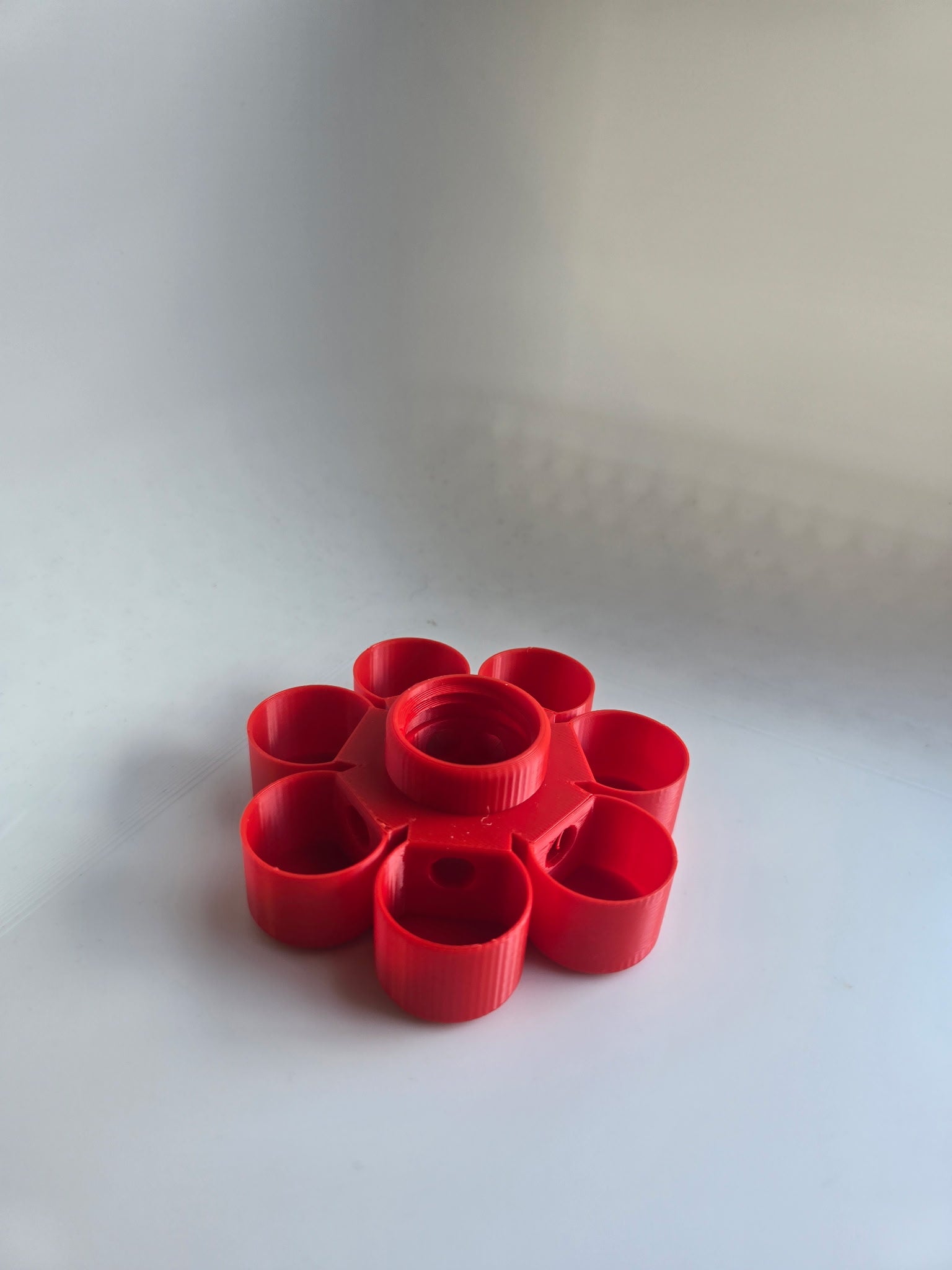 HoneyBunny3D Drinker Base for chicks and quail, durable plastic feeder base with water outlet, designed for poultry watering systems.