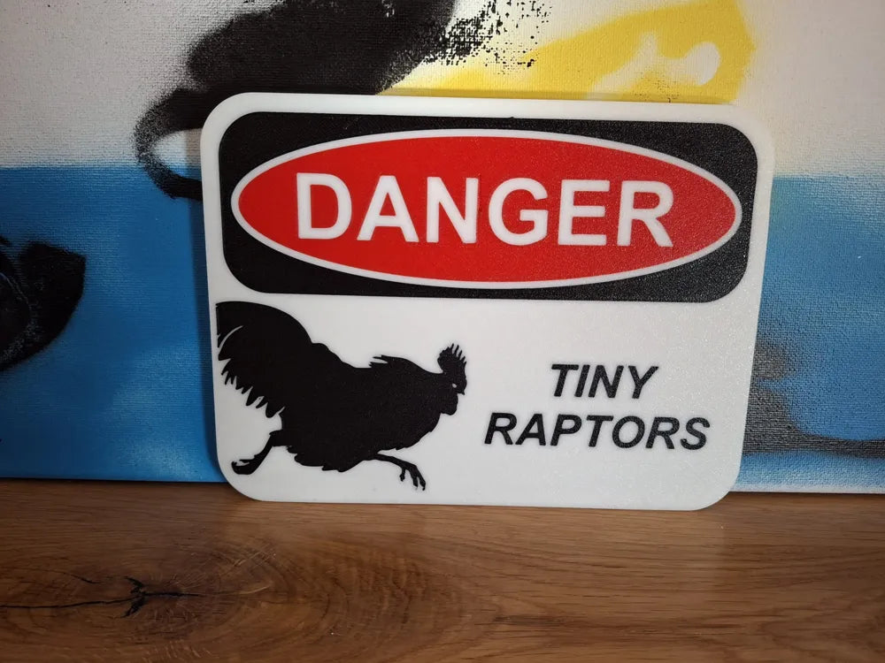HoneyBunny3D Danger Tiny Raptors sign featuring a bright warning design and miniature dinosaur graphics for safety signage.
