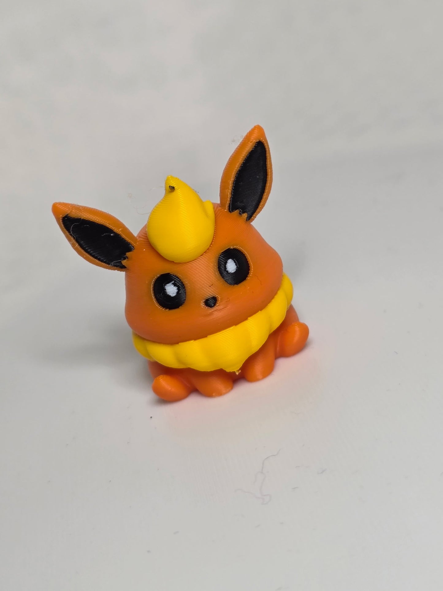 MiniMon toy by HoneyBunny3D showing a cute, colorful plush figure with detailed features and soft fabric texture.