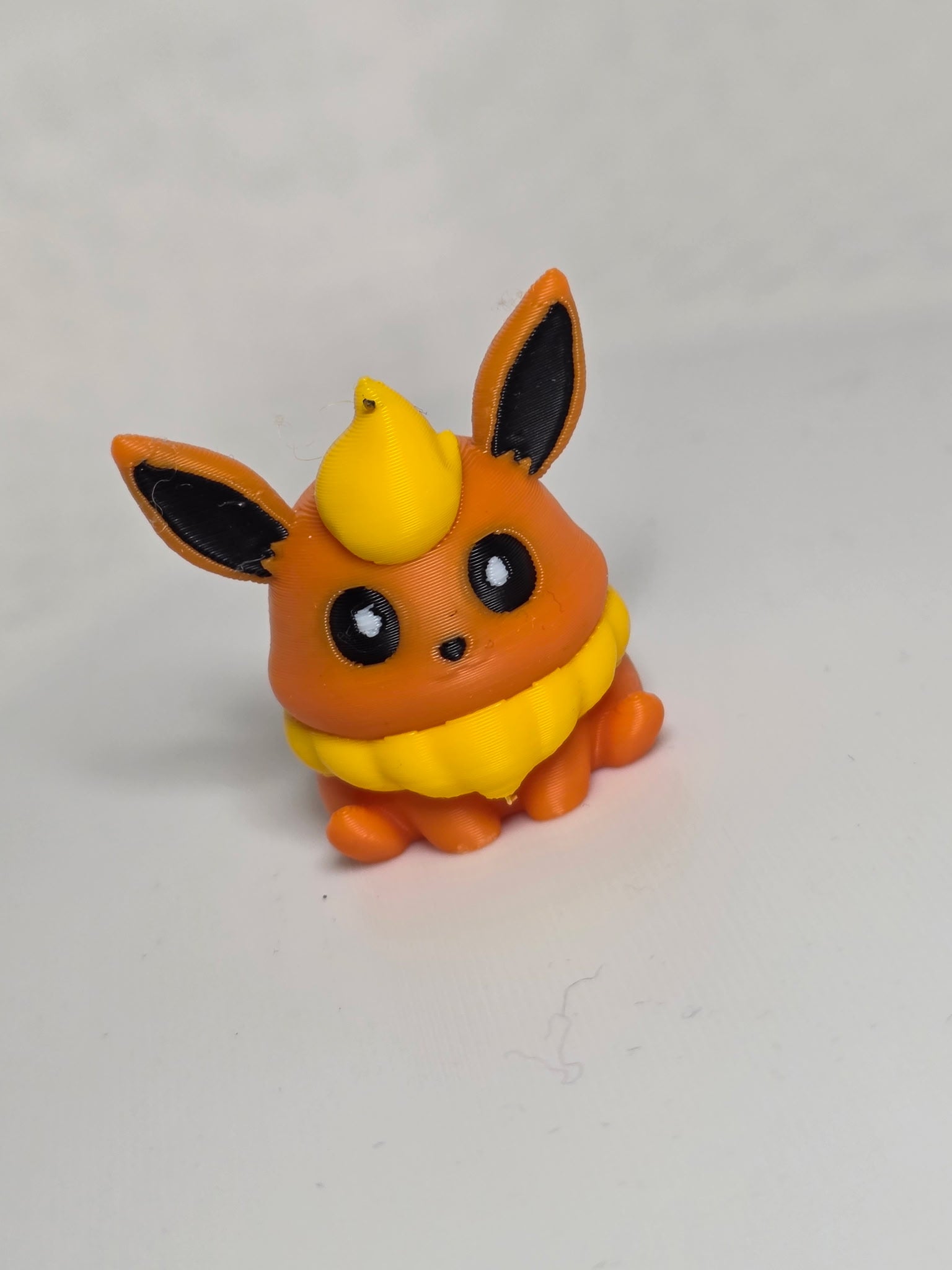 MiniMon toy by HoneyBunny3D showing a cute, colorful plush figure with detailed features and soft fabric texture.