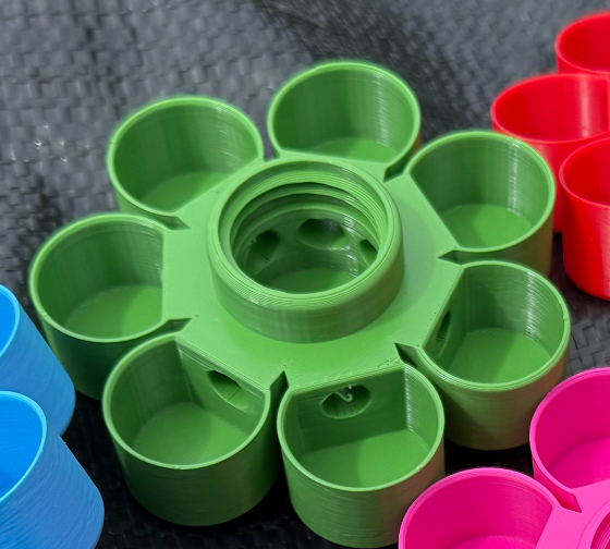 HoneyBunny3D Drinker Base for chicks and quail, shown in use with water supply connection in a detailed product illustration.