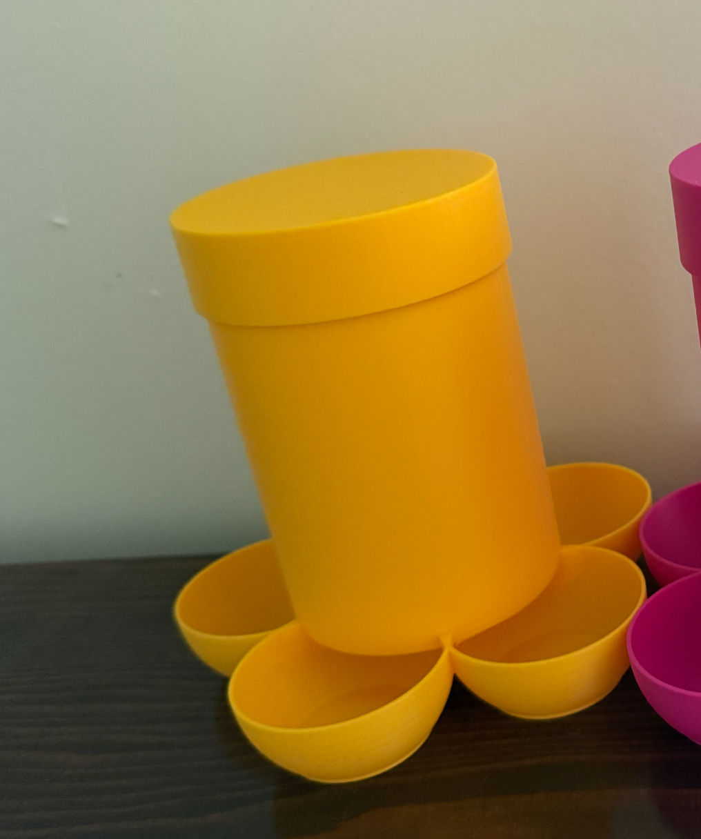 Small chick feeder by HoneyBunny3D, showing a clear plastic container with multiple feeding ports for young poultry.
