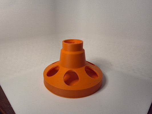 HoneyBunny3D feeder base for chicks and quail, designed to fit soda bottles, shown attached to a bottle in the image.