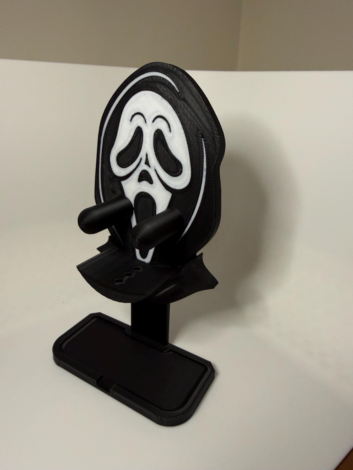 HoneyBunny3D Ghost Face Scrub Daddy holder mounted on a wall, designed for organizing kitchen sponges with a spooky ghost face design.