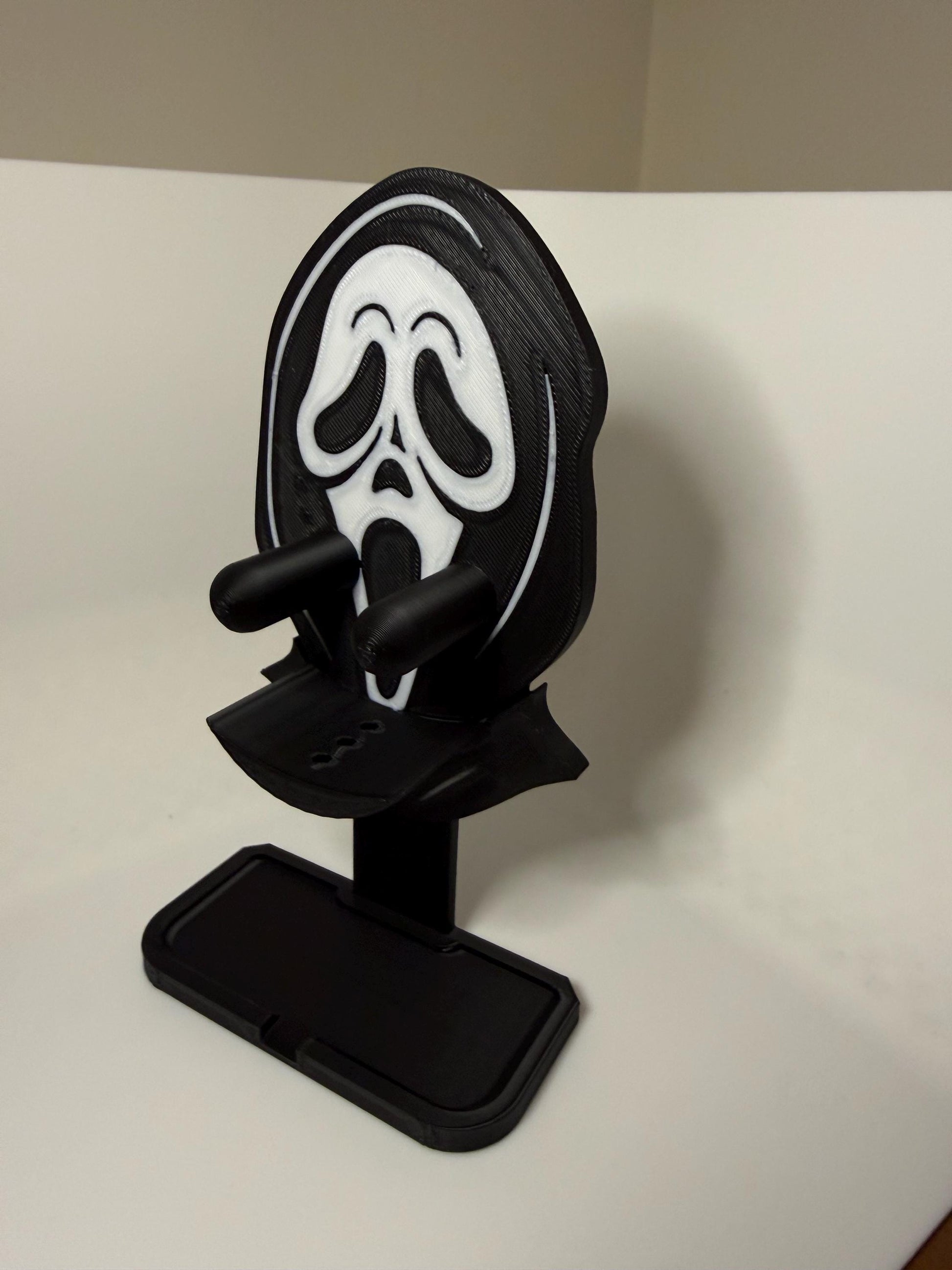 HoneyBunny3D Ghost Face Scrub Daddy holder mounted on a wall, designed for organizing kitchen sponges with a spooky ghost face design.
