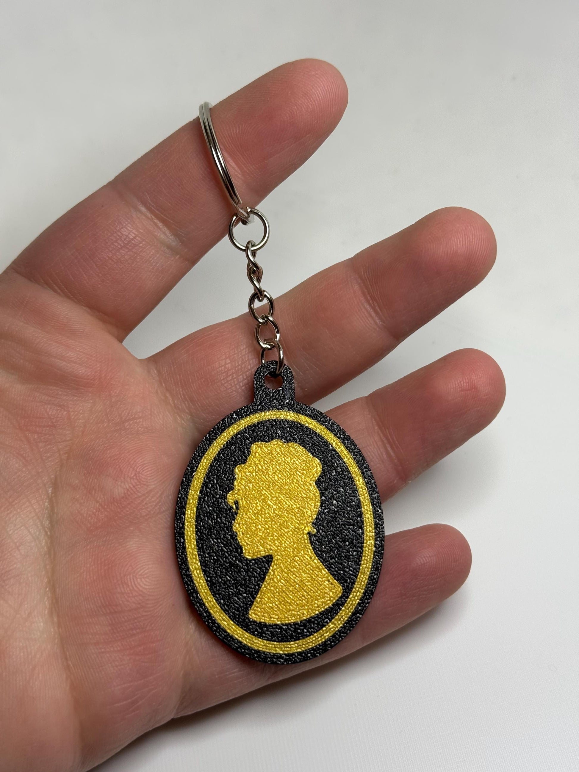 Lady Whistledown keychain charm by HoneyBunny3D featuring a detailed character design on a metal keyring.