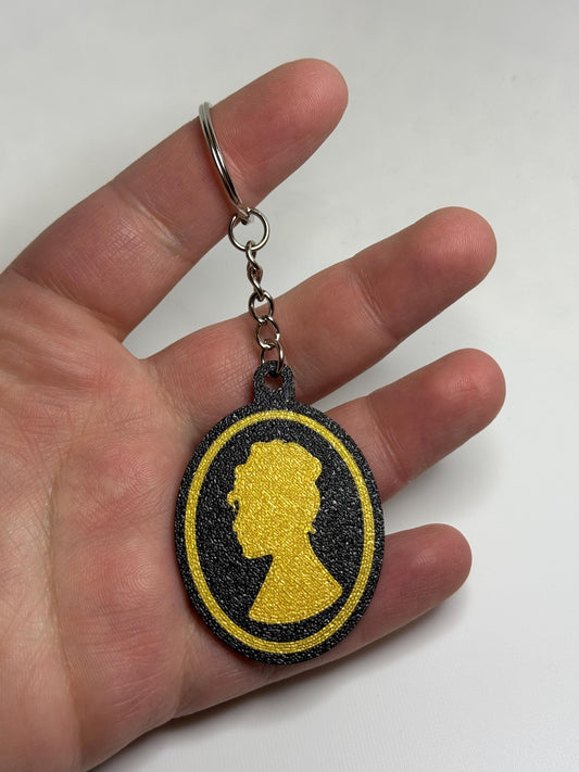Lady Whistledown keychain charm by HoneyBunny3D featuring a detailed character design on a metal keyring.