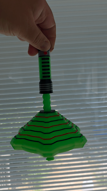 HoneyBunny3D glow-in-the-dark lightsaber fidget toy with vibrant lightsaber design and glowing effects in a GIF image.